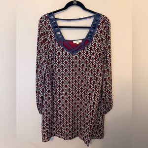 Blue and red patterned dress with detailed neckline